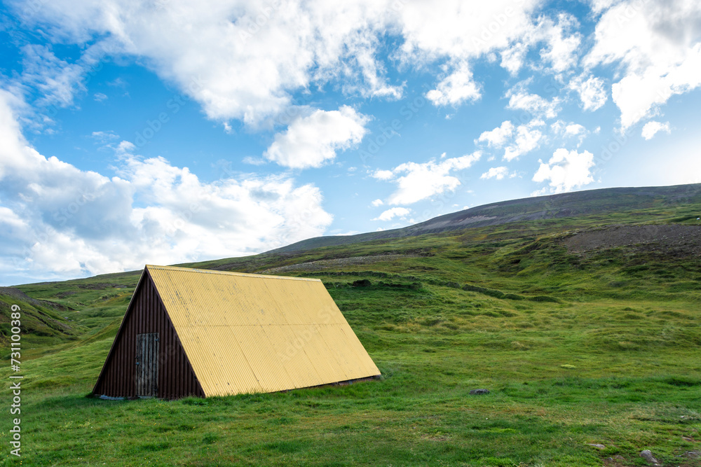 Abandoned wooden house on a green meadow in Iceland. Abandoned wooden house on a green meadow in Iceland.