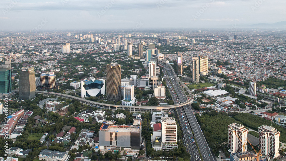 Naklejka premium Panoramic cityscape of Indonesia capital city Jakarta at sunset. A rare clear day in the polluted city.