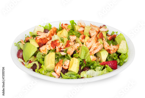  Grilled Chicken Salad with avocado, lettuce, cucumber, tomato and crumbled feta cheese with vinaigrette dressing in white plate on white background 