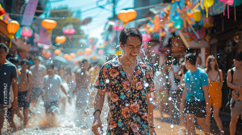 Close up happy Young man having fun on playing water During the Songkran Festival on Khaosan Road, Bangkok, Thailand © supaporn28