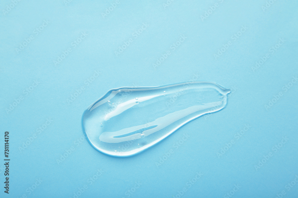 Cosmetic smears of creamy texture on a pastel blue background