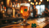 Saint Patrick's day.Glass of beer on bar with four clover leaves. Traditional symbols. Shamrock. Glass of beer on bar in pub on wooden table sparkling lights.