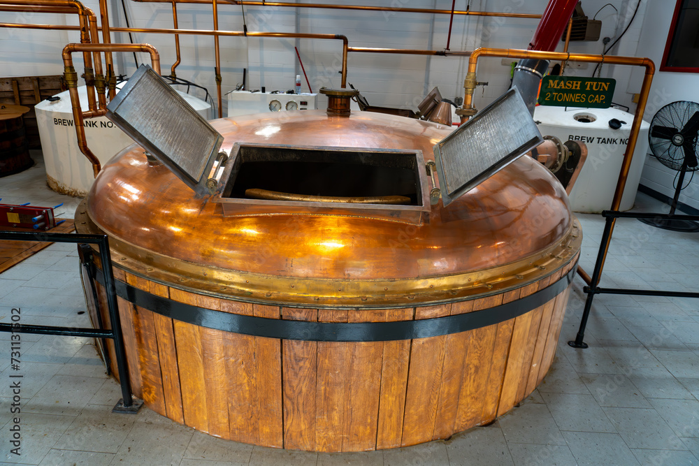 Fototapeta premium Whisky distillery. Large tank called mash tun or tub for fermentation, agitating, mashing.