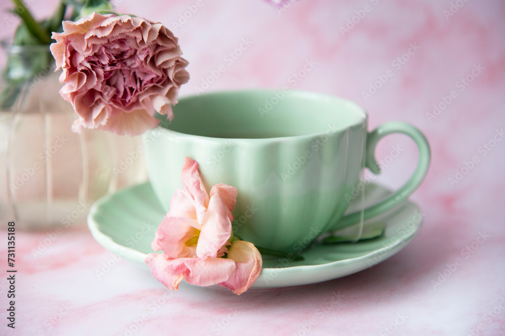 cup of coffee and pink flowers cup of coffee and pink flowers