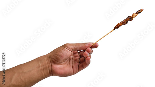 Fotografi Hand-holding chicken satay isolated on a transparent background