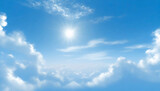 Sunny blue sky background with white clouds.