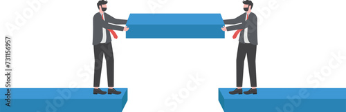Build business bridge connect path together, solution or teamwork idea, cooperation or collaboration to success together concept, business people team help building the bridge to connect the way.


