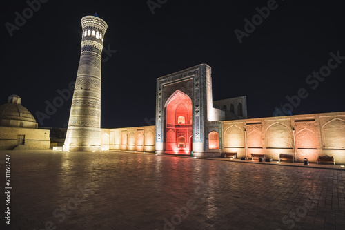 Evening exterior of Kalon Po-i-Kalyan Mosque, Mir Arab madrasasi and Kalyan Minaret in the ancient city of Bukhara in Uzbekistan, night view of madrasah, mosque and minaret photo