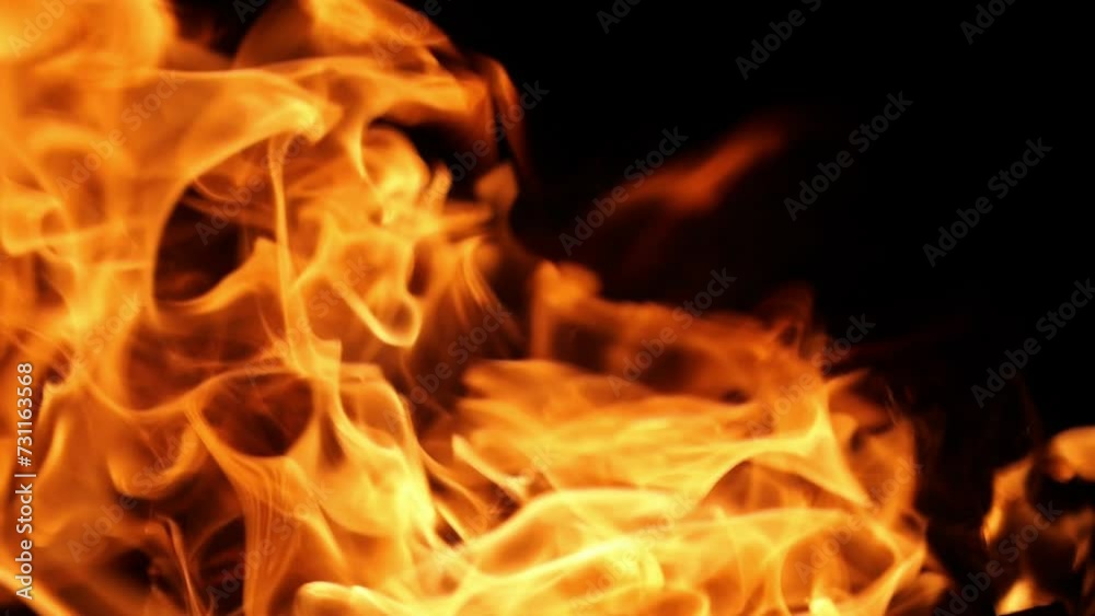 Flames of fire flicker on a black background. Fire hazard. Testura fire. Flames of fire flicker on a black background. Fire hazard. Testura fire.
