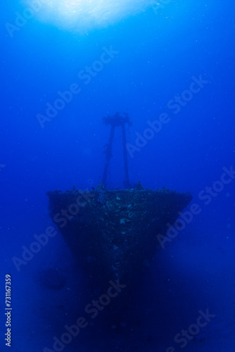 Ship wreck against blue background on a deep dive in Mauritius