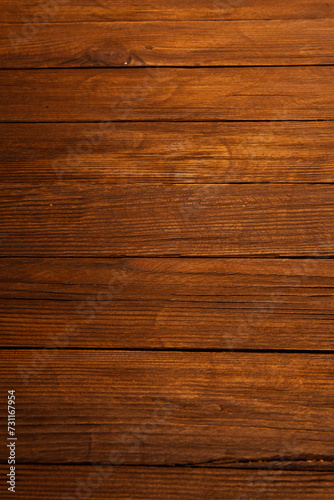 Vintage brown wood background texture with knots and nail holes. Old painted wood wall. Brown abstract background. Vintage wooden dark horizontal boards. Front view with copy space