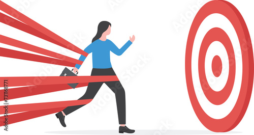 Business difficulty or struggle with career obstacles. businessman tied up with red tape trying to run away with full effort.

