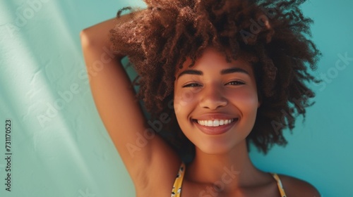 Vibrant afro beauty with colorful makeup in a closeup shot.