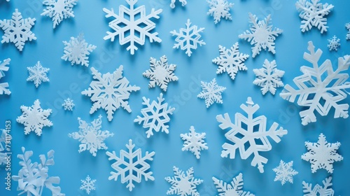 Handmade Paper Snowflakes on Blue Background - Perfect for Winter Season Decorations! Flat Lay