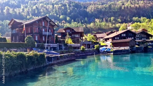 beautiful idylic nature scenery of lake Brienz and village. with turquoise waters. Switzerland, Bern canton.  photo