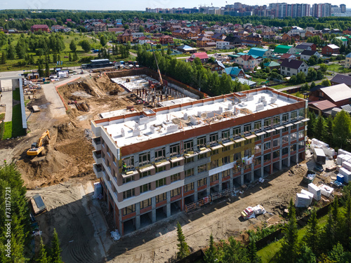 Photography the construction site of an apartment building in the summer from a height