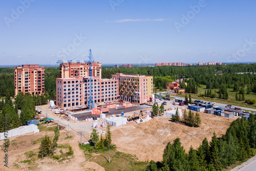 Photography the construction site of an apartment building in the summer from a height