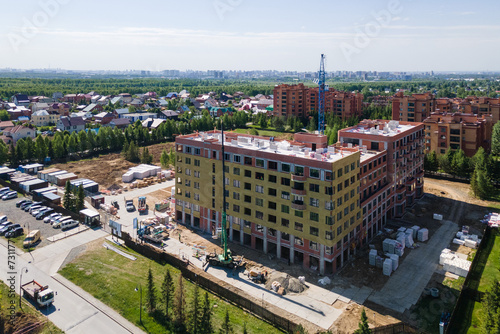 Photography the construction site of an apartment building in the summer from a height