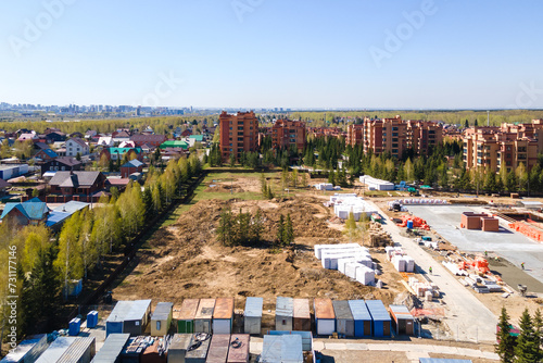 Photography the construction site of an apartment building in the summer from a height
