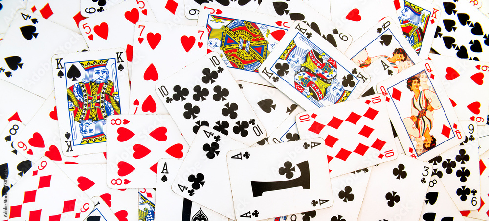Card games. Zenithal view on French-suited decks. Background and backdrop with poker cards for casino and gambling games. Ideal for texture and pattern. Card games. Zenithal view on French-suited decks. Background and backdrop with poker cards for casino and gambling games. Ideal for texture and pattern.