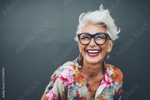 Cheerful Elderly Woman with Grey Hair, Posing Confidently Outdoors on a Modern Background