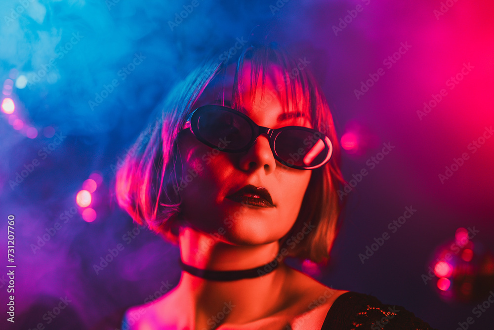 Portrait of young pretty woman neon light. Pussy cat costume for halloween party Portrait of young pretty woman neon light. Pussy cat costume for halloween party