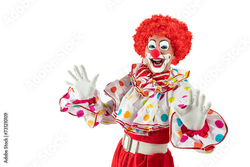 Funny clown. Entertainer Joker in colorful suit and wig. Buffoon with clown whiteface makeup. Trickster  jester  pantomime  mime. Professional actor at event  kids party  circus