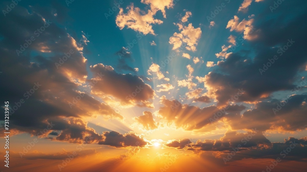 Sunset sky with sun rays and sunset clouds