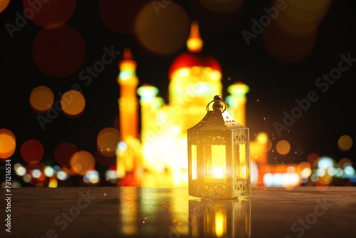 Beautiful Islamic lamp on table at night