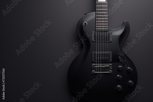 Sleek Black Czaran Electric Guitar In Closeup On Black Background