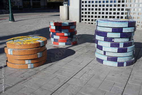 stack of colorful mosaic cement wheels in downtown Reno, NV,  USA