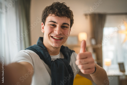 Portrait of teenage boy caucasian teen male young man stand at home photo