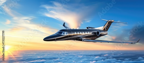 Black luxury business jet flying above clouds in dramatic sunset light. A golden symphony of flight and light.