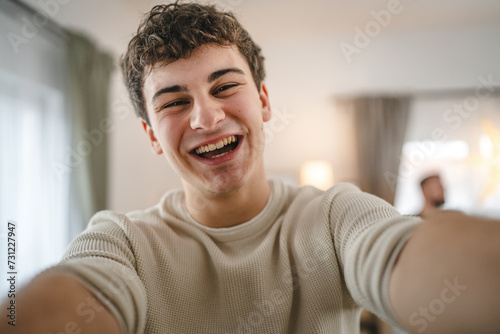 Portrait of teenage boy caucasian teen male young man stand at home