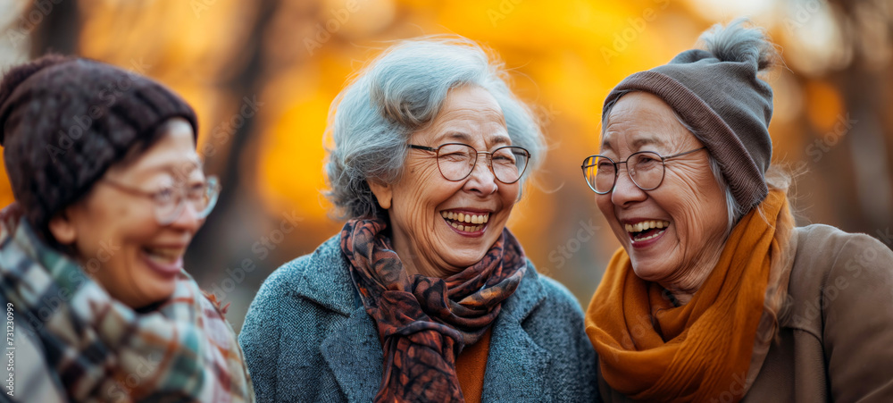 Senior Women in High Spirits Chatting at Autumn Outdoor Festivity
