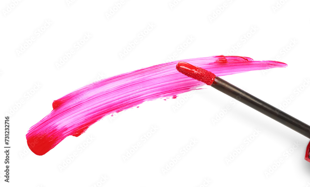 Brush with beautiful pink lipstick stroke on white background