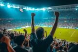 Back view of football or soccer fans cheering their team in a crowded stadium at night Capturing the passion Excitement And community spirit of sports enthusiasts