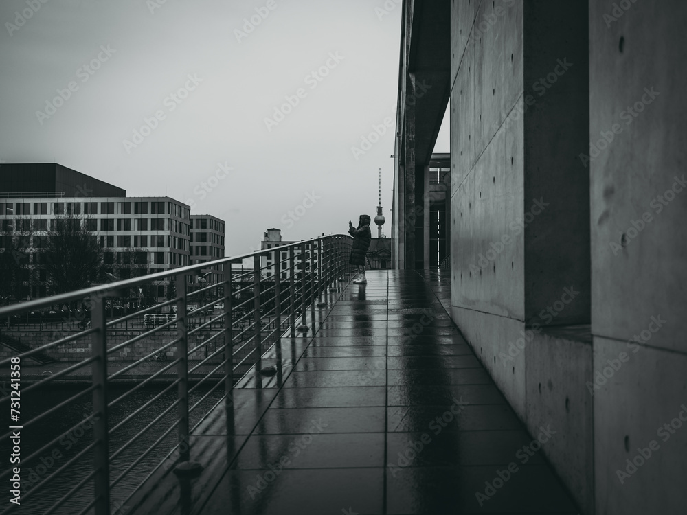 Person on a concrete bridge in Berlin Person on a concrete bridge in Berlin