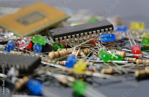 Electronic components. Integrated circuits, central processor unit, resistor and light emitting diodes. Electronics and semiconductor industry concept background. photo
