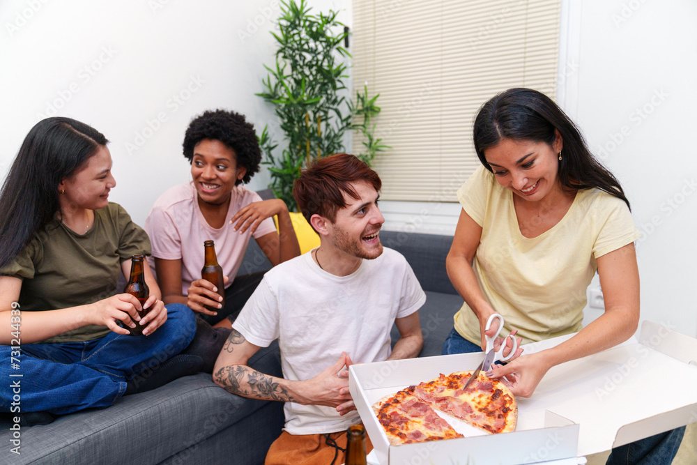 Friends gather on a couch for a birthday celebration, toasting with beers and sharing delicious pizza in a relaxed apartment space. Friends gather on a couch for a birthday celebration, toasting with beers and sharing delicious pizza in a relaxed apartment space.