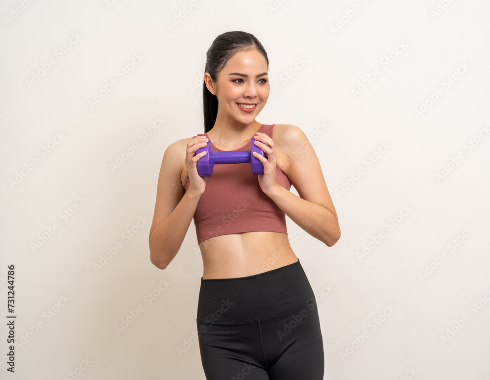 Young beautiful asian woman with sportswear exercises workout with dumbbells on isolated white background. Portrait happy healthy slim fit and firm latin attractive sporty woman weight training Young beautiful asian woman with sportswear exercises workout with dumbbells on isolated white background. Portrait happy healthy slim fit and firm latin attractive sporty woman weight training