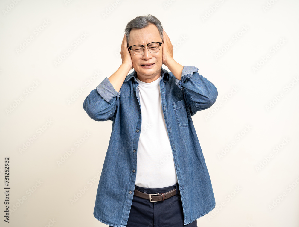 Handsome asian mature old man standing headache on isolated white background. Portrait of serious depressed senior asian man looking at camera. Mature People and lifestyle Handsome asian mature old man standing headache on isolated white background. Portrait of serious depressed senior asian man looking at camera. Mature People and lifestyle
