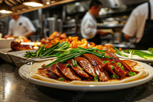 close-up shot of a plate of crispy Peking duck, with thin pancakes, scallions, and hoisin sauce on the side photo
