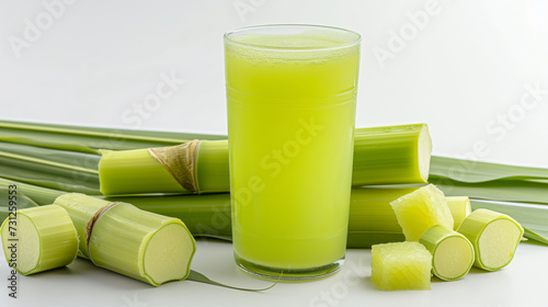 Fresh squeezed sugar cane juice with sugar cane isolated on white background