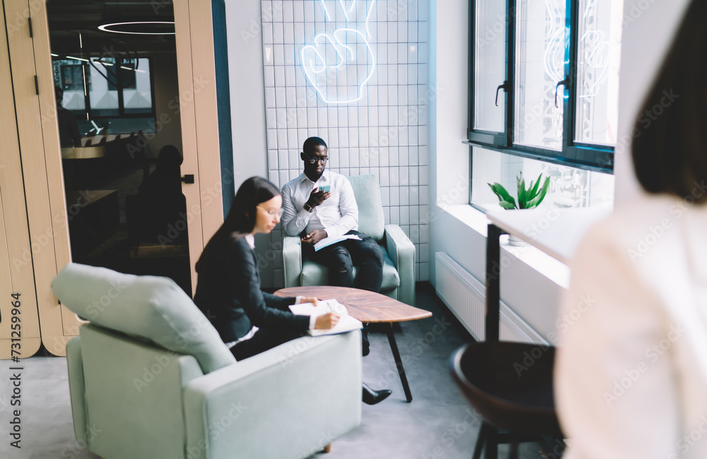 Fototapeta premium Diverse coworkers working in creative workplace