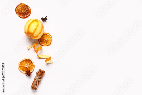 Fototapeta Naklejka Na Ścianę i Meble -  Composition with orange and spices on white background