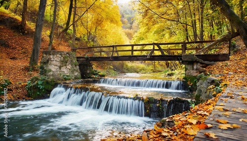 autumn landscape old wooden bridge fnd river waterfall in colorful autumn forest park with yellow leaves