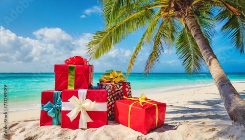 christmas gifts near palm tree on a tropical beach christmas holiday travel © Ashley
