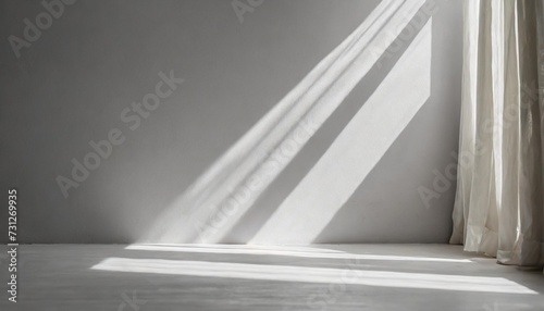 minimalistic abstract gentle light grey background for product presentation with light and shadow of window curtains on wall