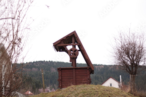 wooden well on the hill in the village